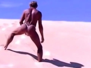 Tanned guy on beach in tiny string thong (temporarily!)